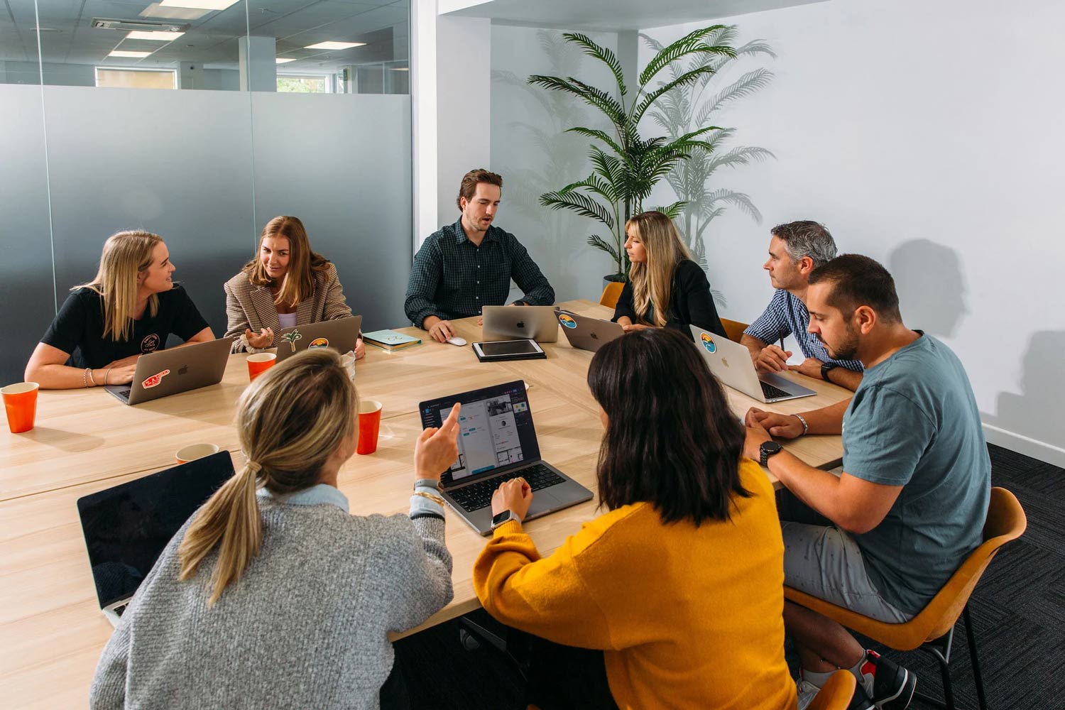 Cross-functional CPG team designing packaging with traceable product codes.