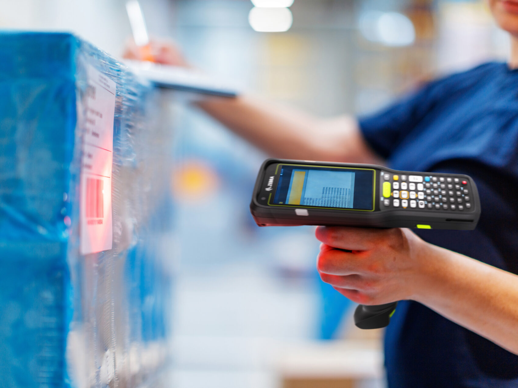 Quality control operator verifying product codes using marking and coding best practices