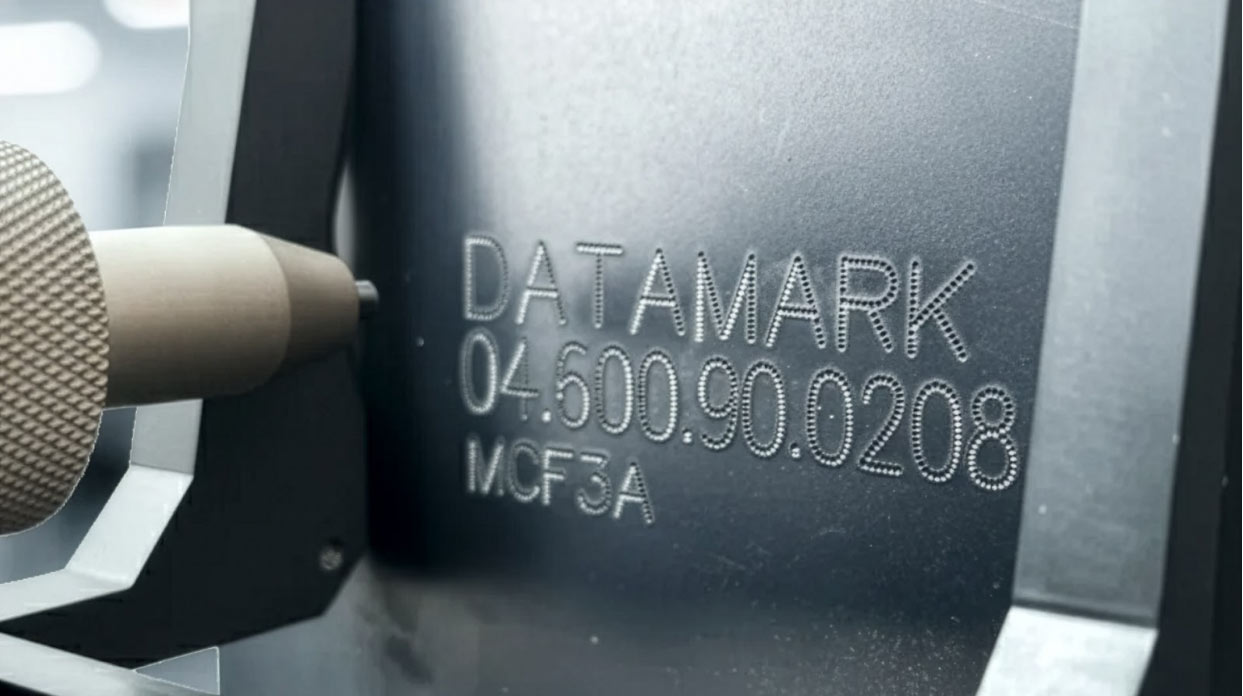  Dot peen marking system engraving serial numbers for automotive part identification and durability