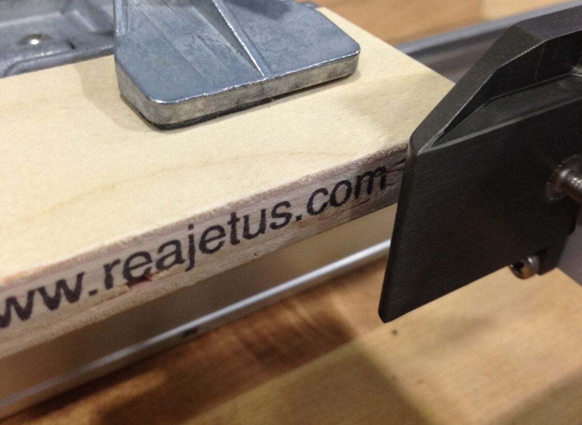 Wood marking applied to lumber in an industrial processing facility