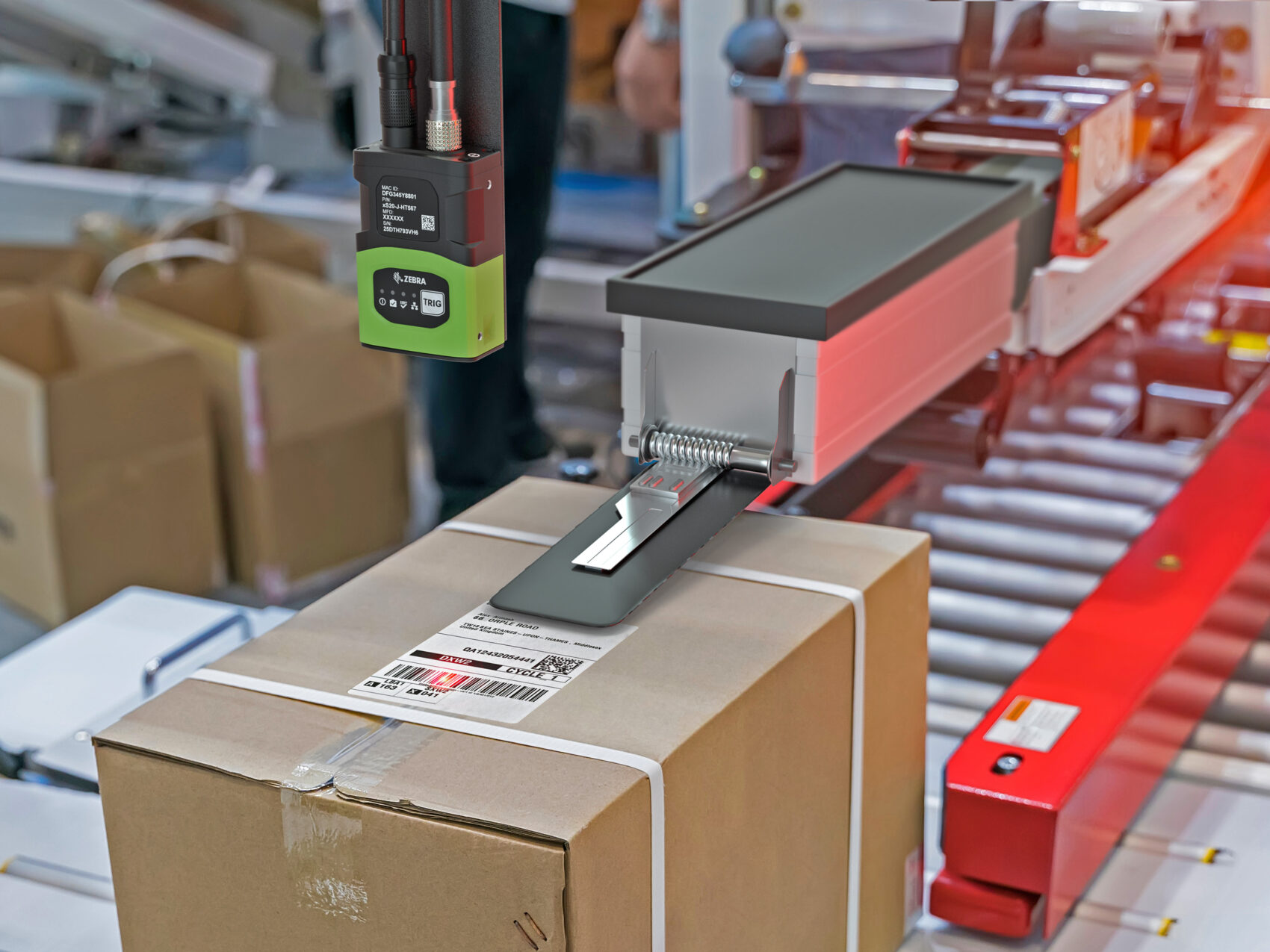 Automated conveyor system scanning 2D barcodes for logistics tracking.