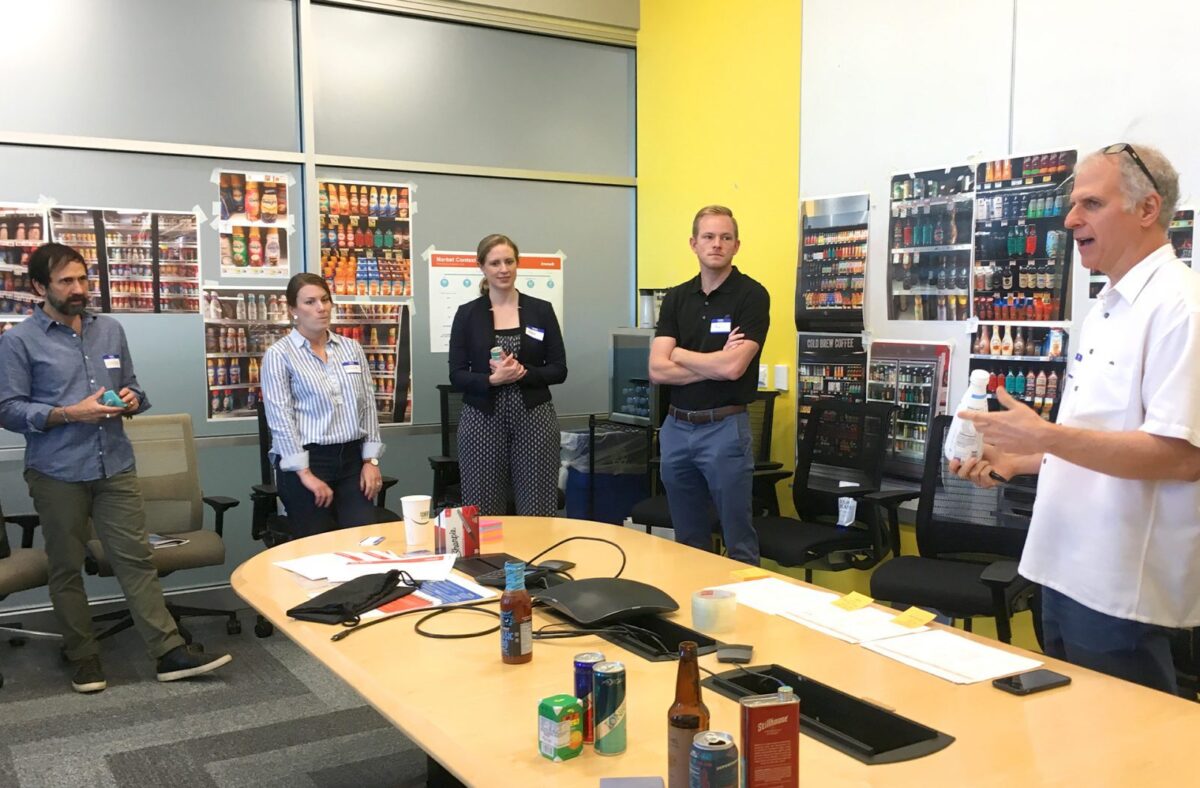 Team of designers and engineers collaborating on new CPG product development and packaging design.