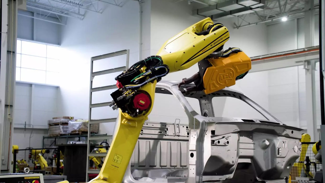 Reliable Solutions for Automotive Part Marking in Manufacturing 3 Robotic laser marking system applying high-precision permanent identification codes on automotive chassis.