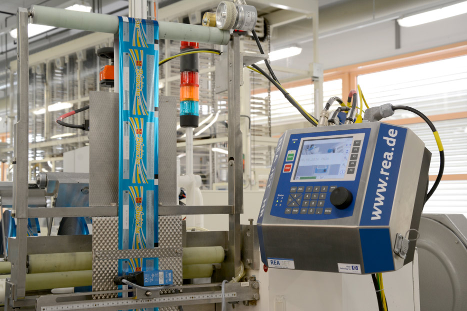 Automated coding systems integrated onto packaging lines