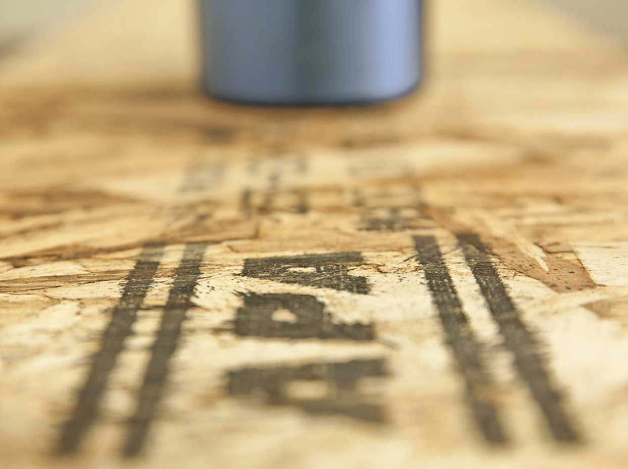 Wood Panel Marking and Coding: Choosing the Right Method 2 Wood panel marking and coding applied to textured OSB